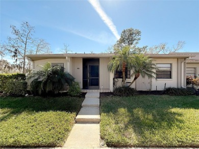 Welcome to this spacious 4-bedroom, 2-bathroom corner-unit villa on East Lake Woodlands Country Club in Florida - for sale on GolfHomes.com, golf home, golf lot