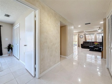 Welcome to this spacious 4-bedroom, 2-bathroom corner-unit villa on East Lake Woodlands Country Club in Florida - for sale on GolfHomes.com, golf home, golf lot