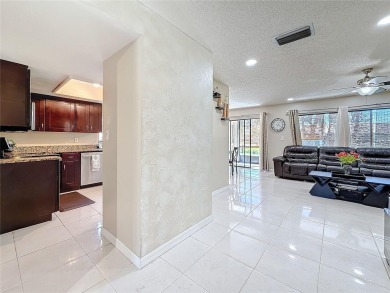 Welcome to this spacious 4-bedroom, 2-bathroom corner-unit villa on East Lake Woodlands Country Club in Florida - for sale on GolfHomes.com, golf home, golf lot