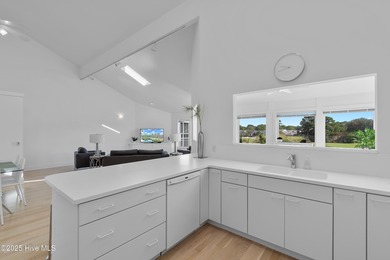 This townhome offers a spectacular water and golf view and is on Members Club At St. James Plantation in North Carolina - for sale on GolfHomes.com, golf home, golf lot