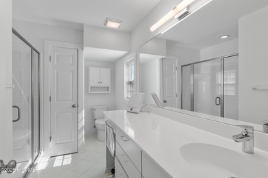 This townhome offers a spectacular water and golf view and is on Members Club At St. James Plantation in North Carolina - for sale on GolfHomes.com, golf home, golf lot