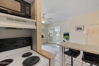 This townhome offers a spectacular water and golf view and is on Members Club At St. James Plantation in North Carolina - for sale on GolfHomes.com, golf home, golf lot