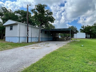 Discover this charming 3-bedroom, 2-bathroom singlewide home on on Nocona Hills Golf Course in Texas - for sale on GolfHomes.com, golf home, golf lot