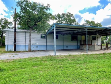 Discover this charming 3-bedroom, 2-bathroom singlewide home on on Nocona Hills Golf Course in Texas - for sale on GolfHomes.com, golf home, golf lot