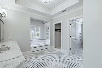 Discover the epitome of luxury and elegance in the gated TPC on TPC At Sugarloaf Golf Club in Georgia - for sale on GolfHomes.com, golf home, golf lot