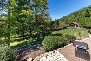 Nestled amidst the scenic beauty of mature trees and lush on Eagle Ridge Inn and Resort in Illinois - for sale on GolfHomes.com, golf home, golf lot