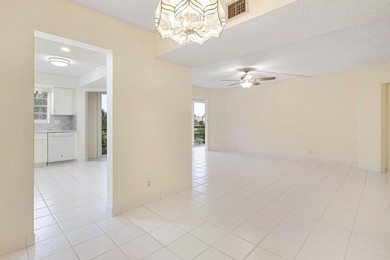WELCOME TO THIS SPARKLING, UPDATED CONDO WITH BEAUTIFUL GOLF & on Poinciana Golf Club in Florida - for sale on GolfHomes.com, golf home, golf lot