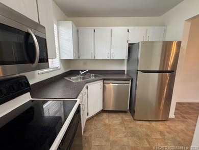 Experience resort-style living with unlimited golf in this 1 BR on Monterey Yacht and Country Club in Florida - for sale on GolfHomes.com, golf home, golf lot