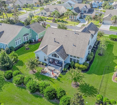 Welcome to this stunning home located in the prestigious gated on Surf Golf and Beach Club in South Carolina - for sale on GolfHomes.com, golf home, golf lot