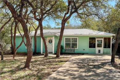 Nestled beneath large shade oak trees, this fully furnished on Rockport Country Club in Texas - for sale on GolfHomes.com, golf home, golf lot