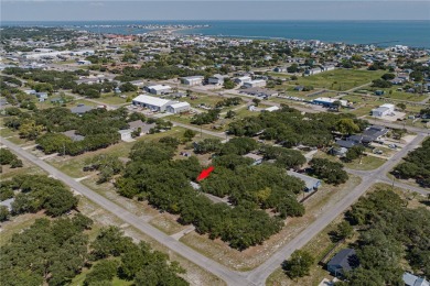 Nestled beneath large shade oak trees, this fully furnished on Rockport Country Club in Texas - for sale on GolfHomes.com, golf home, golf lot