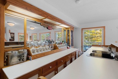 Charming 2BR/3BA year-round lakefront home on full rec Wheeler on McCauslin Brook Golf and Country Club in Wisconsin - for sale on GolfHomes.com, golf home, golf lot