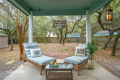 Nestled beneath large shade oak trees, this fully furnished on Rockport Country Club in Texas - for sale on GolfHomes.com, golf home, golf lot