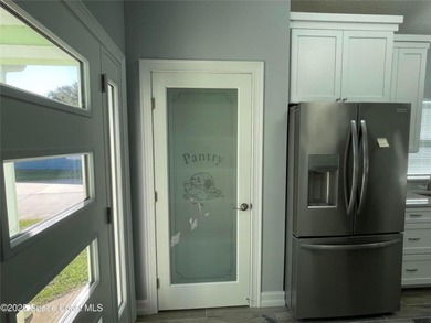 A newly constructed custom home with a detached garage awaits on Willow Lakes RV and Golf Resort in Florida - for sale on GolfHomes.com, golf home, golf lot