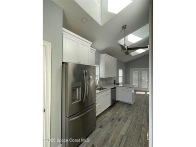 A newly constructed custom home with a detached garage awaits on Willow Lakes RV and Golf Resort in Florida - for sale on GolfHomes.com, golf home, golf lot