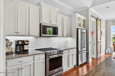 This stunning Creekside home offers front-row views of the on Crow Creek Golf Club in North Carolina - for sale on GolfHomes.com, golf home, golf lot