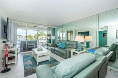MILLION DOLLAR VIEW.. PRIVATE COMMUNITY BEACH.. FULLY UPDATED on Isla Del Sol Yacht and Country Club in Florida - for sale on GolfHomes.com, golf home, golf lot