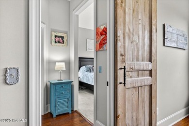 This stunning Creekside home offers front-row views of the on Crow Creek Golf Club in North Carolina - for sale on GolfHomes.com, golf home, golf lot