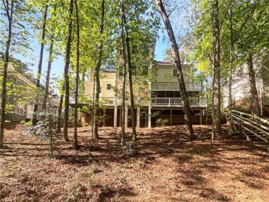 Welcome to this stunning 4-bedroom, 3.5-bath Woodstock home that on Canongate At Eagle Watch Golf Club in Georgia - for sale on GolfHomes.com, golf home, golf lot