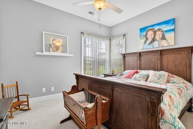 This stunning Creekside home offers front-row views of the on Crow Creek Golf Club in North Carolina - for sale on GolfHomes.com, golf home, golf lot