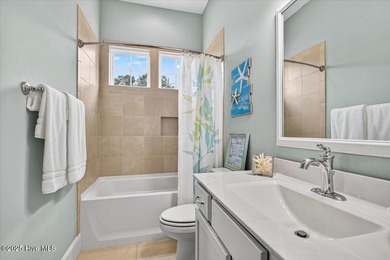 This stunning Creekside home offers front-row views of the on Crow Creek Golf Club in North Carolina - for sale on GolfHomes.com, golf home, golf lot