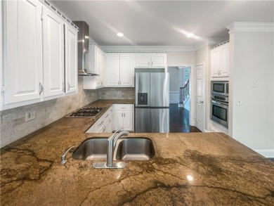 Welcome to this stunning 4-bedroom, 3.5-bath Woodstock home that on Canongate At Eagle Watch Golf Club in Georgia - for sale on GolfHomes.com, golf home, golf lot