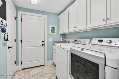 This stunning Creekside home offers front-row views of the on Crow Creek Golf Club in North Carolina - for sale on GolfHomes.com, golf home, golf lot