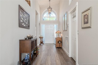 Ballantrae Pool Home with NEW ROOF, custom kitchen, new flooring on Santa Lucia River Club in Florida - for sale on GolfHomes.com, golf home, golf lot