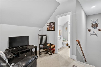 This stunning Creekside home offers front-row views of the on Crow Creek Golf Club in North Carolina - for sale on GolfHomes.com, golf home, golf lot