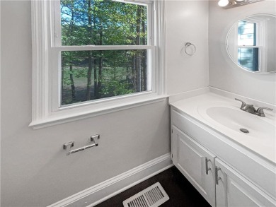 Welcome to this stunning 4-bedroom, 3.5-bath Woodstock home that on Canongate At Eagle Watch Golf Club in Georgia - for sale on GolfHomes.com, golf home, golf lot