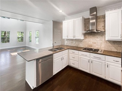 Welcome to this stunning 4-bedroom, 3.5-bath Woodstock home that on Canongate At Eagle Watch Golf Club in Georgia - for sale on GolfHomes.com, golf home, golf lot
