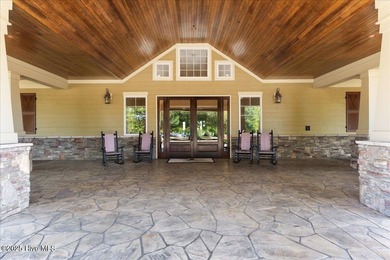 This stunning Creekside home offers front-row views of the on Crow Creek Golf Club in North Carolina - for sale on GolfHomes.com, golf home, golf lot