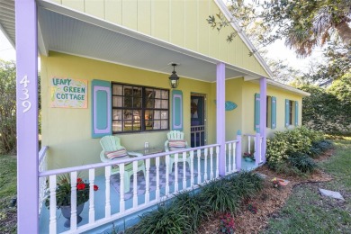 Welcome to Dunedin's Leafy Green Cottage! Nestled in the on The Dunedin Country Club in Florida - for sale on GolfHomes.com, golf home, golf lot