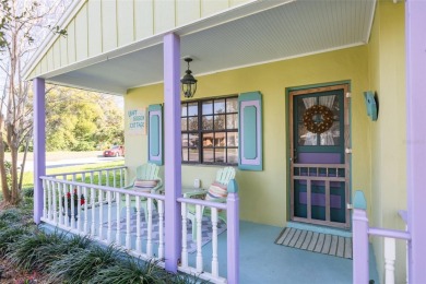 Welcome to Dunedin's Leafy Green Cottage! Nestled in the on The Dunedin Country Club in Florida - for sale on GolfHomes.com, golf home, golf lot