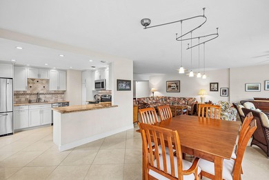 Exceptional golf course views wrap around this renovated on Quail Ridge Golf Course and Country Club in Florida - for sale on GolfHomes.com, golf home, golf lot