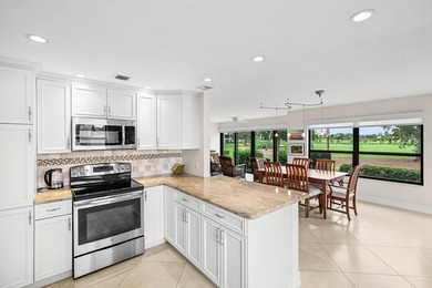 Exceptional golf course views wrap around this renovated on Quail Ridge Golf Course and Country Club in Florida - for sale on GolfHomes.com, golf home, golf lot