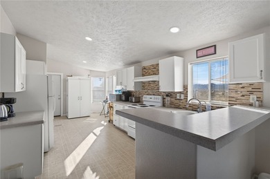 Set on 5 acres in Mountain Vista Ranches, this AR/5A-zoned ranch on Valle Vista Golf Course in Arizona - for sale on GolfHomes.com, golf home, golf lot