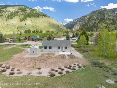 Nestled on a meticulously landscaped lot with a front-row view on Cedar Creek Golf Course in Wyoming - for sale on GolfHomes.com, golf home, golf lot