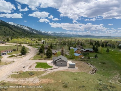 Nestled on a meticulously landscaped lot with a front-row view on Cedar Creek Golf Course in Wyoming - for sale on GolfHomes.com, golf home, golf lot