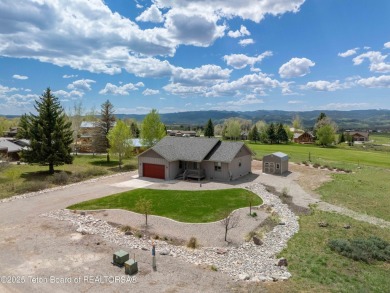 Nestled on a meticulously landscaped lot with a front-row view on Cedar Creek Golf Course in Wyoming - for sale on GolfHomes.com, golf home, golf lot