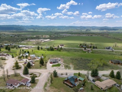 Nestled on a meticulously landscaped lot with a front-row view on Cedar Creek Golf Course in Wyoming - for sale on GolfHomes.com, golf home, golf lot