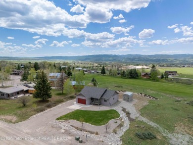 Nestled on a meticulously landscaped lot with a front-row view on Cedar Creek Golf Course in Wyoming - for sale on GolfHomes.com, golf home, golf lot