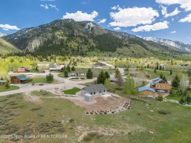 Nestled on a meticulously landscaped lot with a front-row view on Cedar Creek Golf Course in Wyoming - for sale on GolfHomes.com, golf home, golf lot