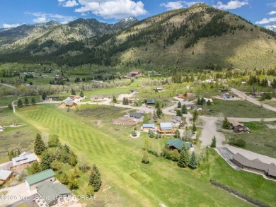 Nestled on a meticulously landscaped lot with a front-row view on Cedar Creek Golf Course in Wyoming - for sale on GolfHomes.com, golf home, golf lot