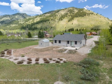Nestled on a meticulously landscaped lot with a front-row view on Cedar Creek Golf Course in Wyoming - for sale on GolfHomes.com, golf home, golf lot