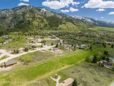 Nestled on a meticulously landscaped lot with a front-row view on Cedar Creek Golf Course in Wyoming - for sale on GolfHomes.com, golf home, golf lot