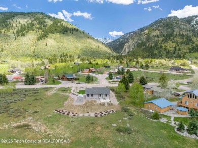 Nestled on a meticulously landscaped lot with a front-row view on Cedar Creek Golf Course in Wyoming - for sale on GolfHomes.com, golf home, golf lot
