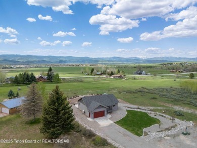 Nestled on a meticulously landscaped lot with a front-row view on Cedar Creek Golf Course in Wyoming - for sale on GolfHomes.com, golf home, golf lot