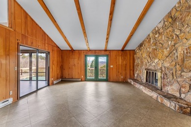 Tucked inside Mill Creek, this inviting mountain retreat is all on Mill Creek Country Club in North Carolina - for sale on GolfHomes.com, golf home, golf lot