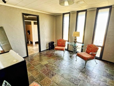 This versatile commercial property offers a unique opportunity on Perryton Municipal Golf Course in Texas - for sale on GolfHomes.com, golf home, golf lot